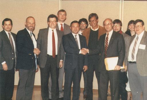 Left to right: Phil Boyce, astronaut Dr. Loren Acton, Jim Plaxco, Bill Schmid, cosmonaut Colonel Yuri Victorovich Romanenko, David White, Joe Redfield, Jeffrey Liss, Bill Higgins, Melissa Bodeau, and Larry Ahearn October 10, 1989 at the Northeastern Illinois University Distinguished Lectureship Series event where cosmonaut Colonel Yuri Victorovich Romanenko and astronaut Dr. Loren Acton spoke on U.S./Soviet cooperation in space exploration and development.