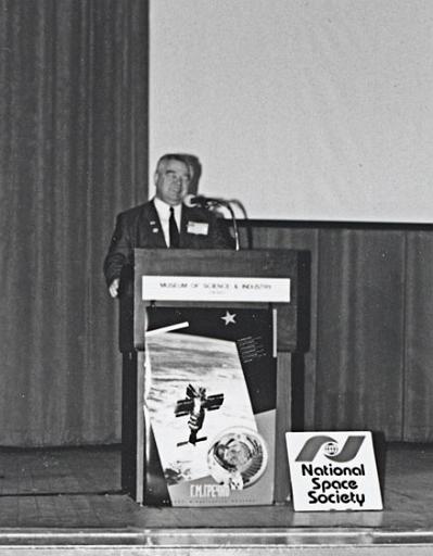 Cosmonaut Georgi Grechko speaking to an audience at Chicago's Museum of Science and Industry as part of a CSSS sponsored speaking tour of Chicago in April 1993
