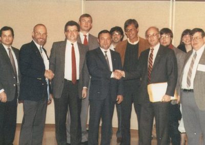 Left to right: Phil Boyce, astronaut Dr. Loren Acton, Jim Plaxco, Bill Schmid, cosmonaut Colonel Yuri Victorovich Romanenko, David White, Joe Redfield, Jeffrey Liss, Bill Higgins, Melissa Bodeau, and Larry Ahearn October 10, 1989 at the Northeastern Illinois University Distinguished Lectureship Series event where cosmonaut Colonel Yuri Victorovich Romanenko and astronaut Dr. Loren Acton spoke on U.S./Soviet cooperation in space exploration and development.