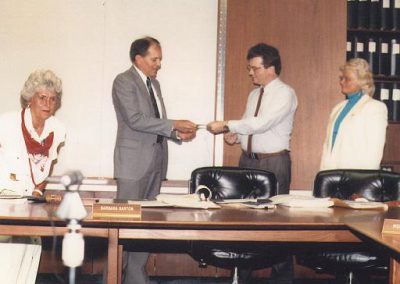 Northern Illinois Space Advocacy President Jim Plaxco presenting the president of Harper College with a $500 donation towards the construction of an observatory on behalf of Chicago area NSS members and chapters. NISA subsequently merged with CSSS.