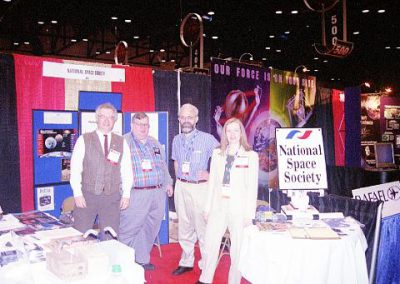 The National Space Society booth at the 2002 World Space Congress. Left to right: CSSS Jim Plaxco, Larry Ahearn, Bruce MacKenzie, Marianne Dyson.
