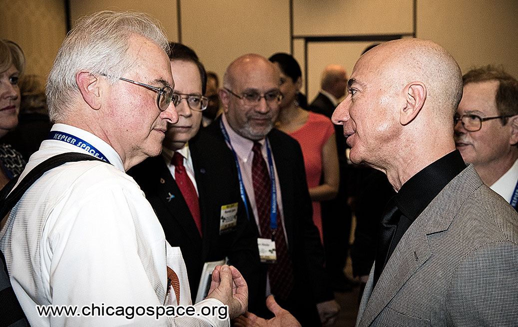 Jim Plaxco speaking with Jeff Bezos at the 2018 International Space Development Conference VIP reception