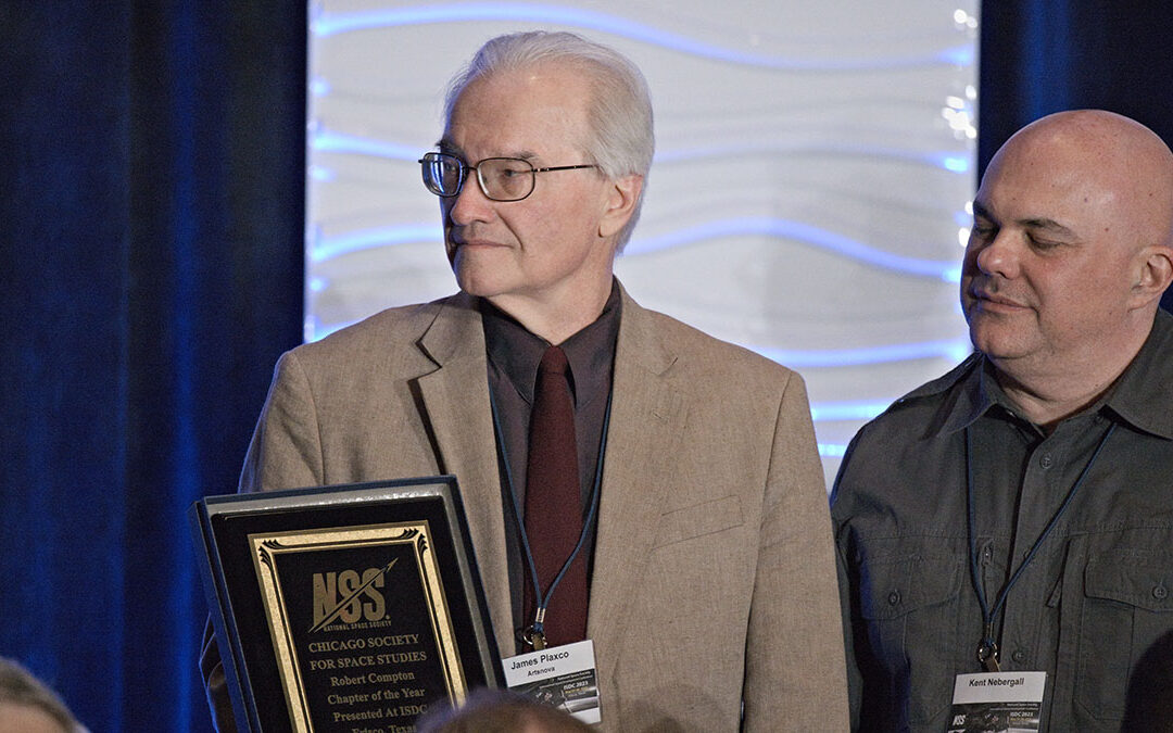 Chicago Society for Space Studies President Jim Plaxco on stage with the NSS Chapter of the Year Award