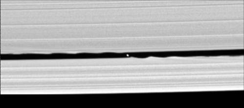 Figure 3. Cassini images the waves created by the 4-mile wide moon Daphnis orbiting within the Keeler Gap of Saturn's rings